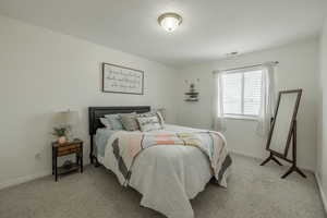 View of carpeted bedroom