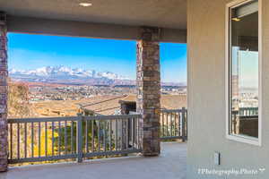 View of patio / terrace with a mountain view and a balcony