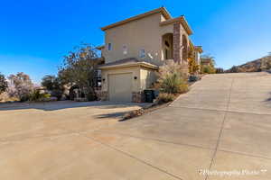 View of side of property featuring a garage