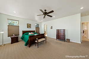 Carpeted bedroom with ceiling fan