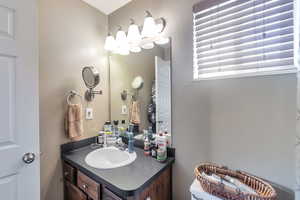 Bathroom with vanity and toilet