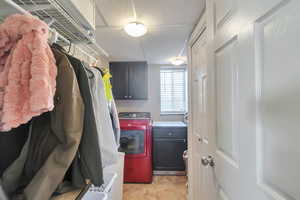 Laundry room with cabinets and separate washer and dryer