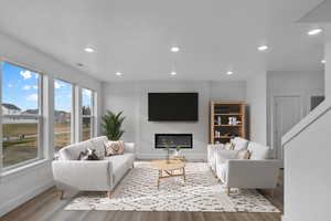 Living room with light hardwood / wood-style floors