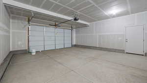 Garage featuring a garage door opener