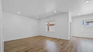 Spare room featuring hardwood / wood-style floors