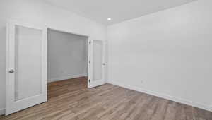 Unfurnished bedroom with light wood-type flooring