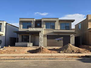 View of front of property featuring a garage