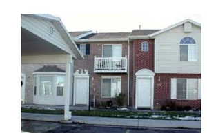 View of front of home featuring a balcony