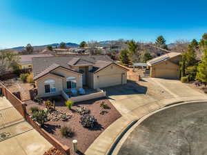 Single story home featuring a garage and a mountain view