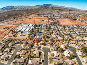 Birds eye view of property with a mountain view