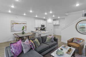 Living room with light hardwood / wood-style flooring