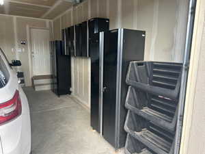 Garage featuring black refrigerator