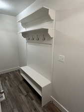 Mudroom with dark hardwood / wood-style floors