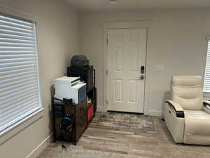 Foyer entrance featuring hardwood / wood-style floors