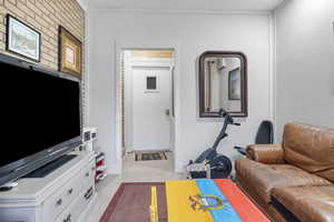 Workout room with light tile patterned floors