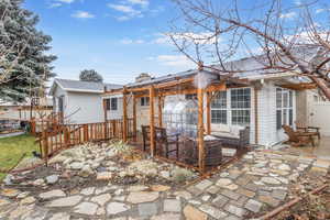 Rear view of property featuring a patio area and outdoor lounge area