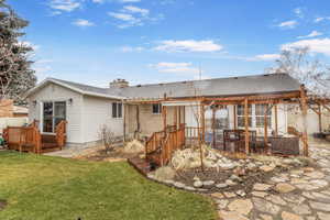 Rear view of house with a yard, a patio area, outdoor lounge area, and a deck