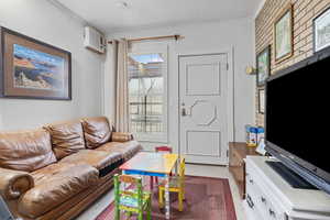 Living room with an AC wall unit