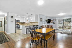 Dining room with sink and light hardwood / wood-style floors