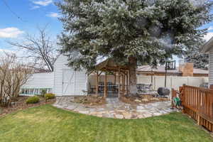 Exterior space featuring a shed and a patio