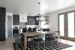 Kitchen featuring pendant lighting, sink, light hardwood / wood-style flooring, tasteful backsplash, and a chandelier