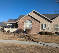 Single story home with a front lawn