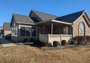 View of front of house with a front yard