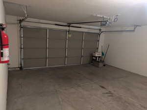 Garage featuring a garage door opener