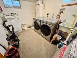 Washroom with washing machine and dryer