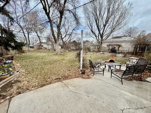 View of patio featuring exterior fireplace