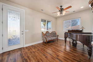 Foyer featuring dark hardwood / wood-style floors and ceiling fan