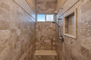 Bathroom with a tile shower