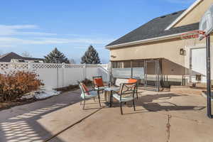 Back patio off the garage and deck