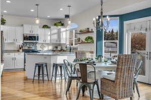 Light filled dining with plenty of seating at the table and bar