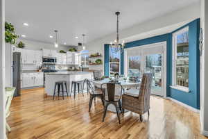 Connected dining room, living room, and kitchen.