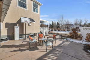 Patio with fire pit and basketball standard