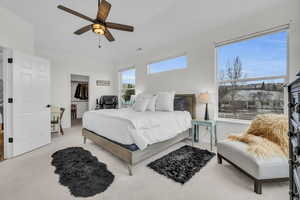 Primary bedroom with 13' ceilings, walk in closet, and space to relax