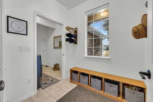 Mudroom with closet and built in storage bench