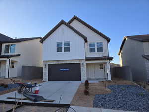 View of front facade featuring a garage