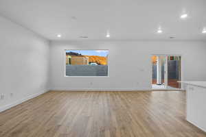 Spare room featuring light wood-type flooring