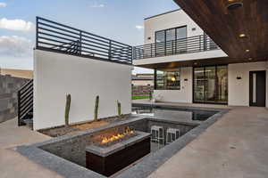 View of patio featuring an outdoor fire pit