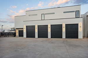 View of garage at dusk