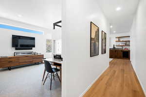 Corridor featuring light wood-type flooring