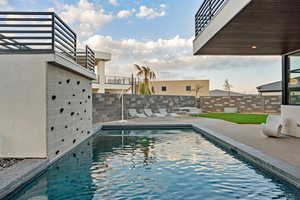 View of swimming pool with a patio area