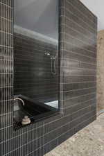 Bathroom featuring a tile shower