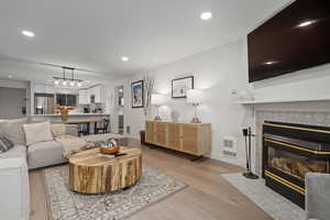 Living room with light hardwood / wood-style floors