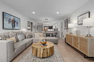 Living room with light hardwood / wood-style floors