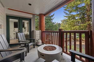 Balcony featuring an outdoor fire pit