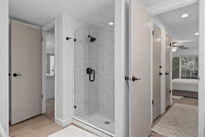 Bathroom with wood-type flooring and walk in shower