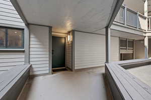 Doorway to property featuring a balcony